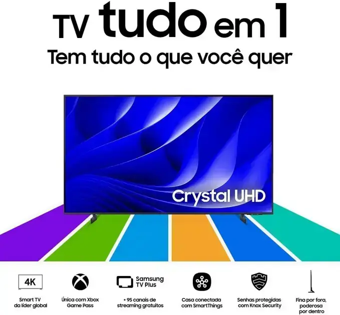 Imagem frontal de uma televisão com fundo colorido com várias faixas em cores diferentes, como roxo, verde e azul.